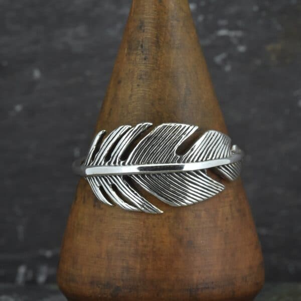 sterling silver wide feather ring facing forward
